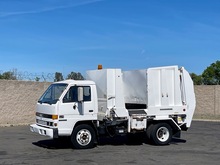 1989 GMC 6000 Heil Retriever Side Load Garbage Truck